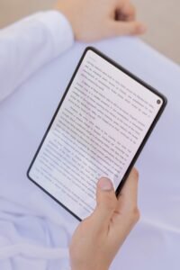 Professional using a compact tablet UAE in a bright café with PaperMatte Display.