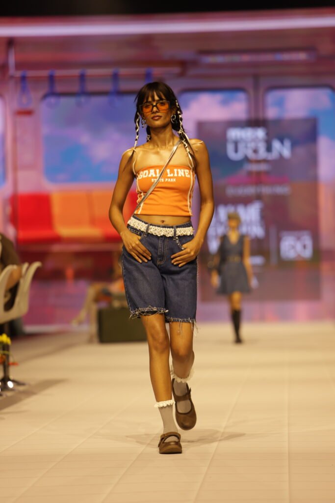 Model wearing a graphic tee from the Max Fashion collection in Dubai.