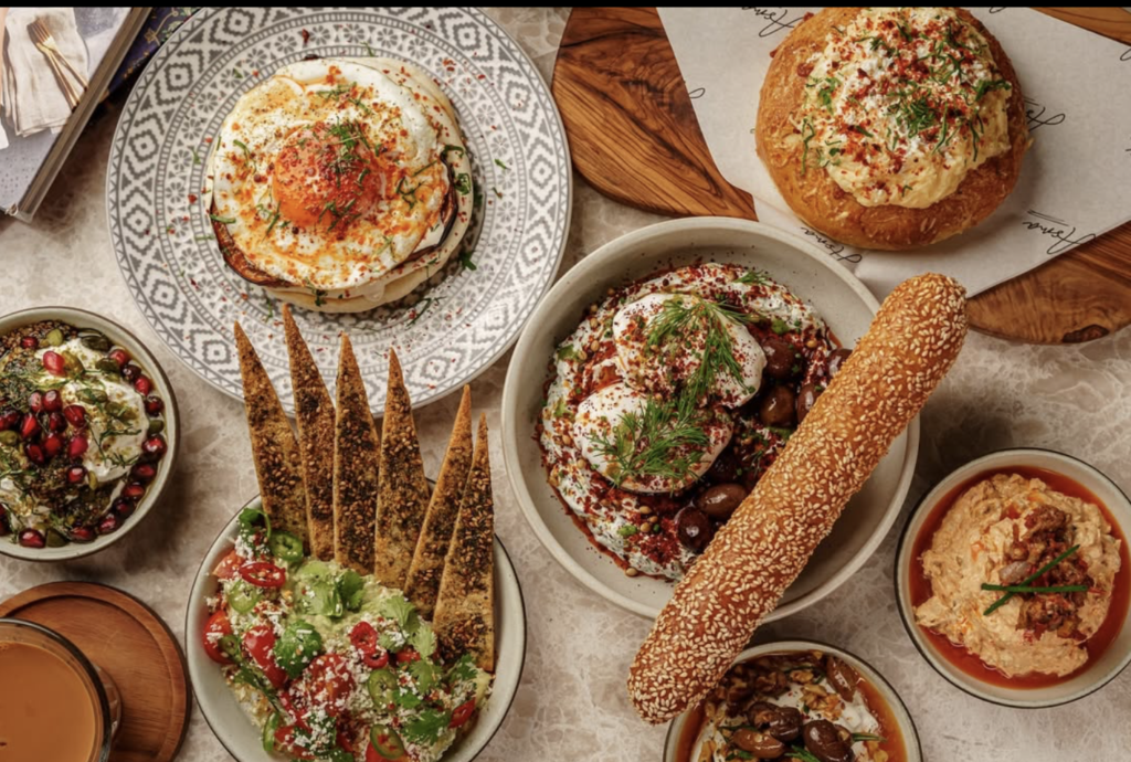 Vibrant sharing plates of a Middle Eastern brunch at Asma Dubai.