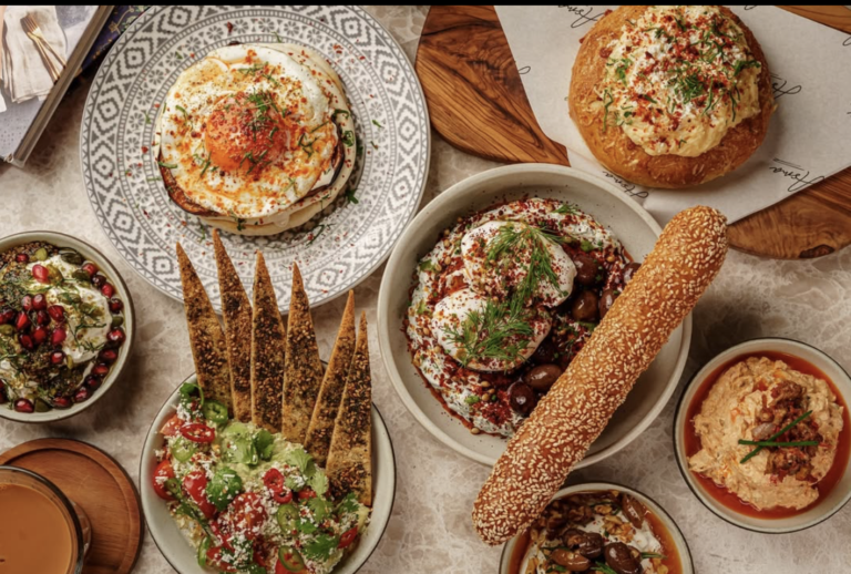 Vibrant sharing plates of a Middle Eastern brunch at Asma Dubai.
