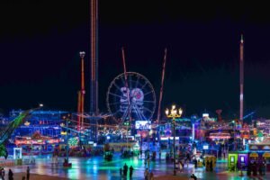High-energy Global Village rides and neon lights at Carnaval Dubai.