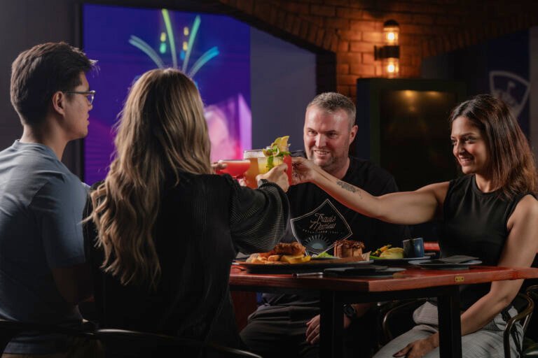 Happy family enjoying weekend brunch deals and a Dubai family staycation getaway.