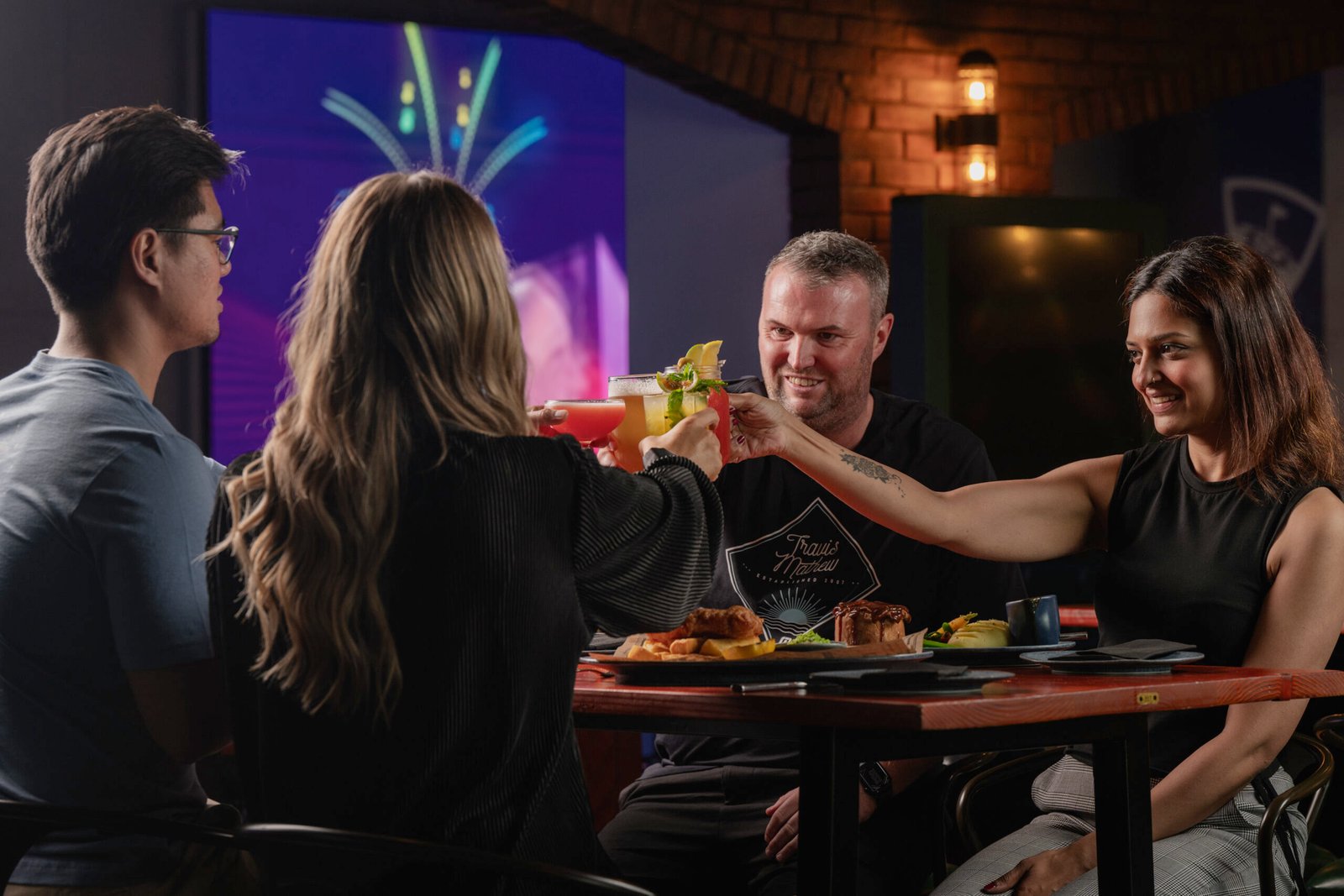 Happy family enjoying weekend brunch deals and a Dubai family staycation getaway.