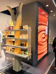 Showcasing elite signature bottles from top niche perfumery Dubai houses at an international art exhibition.