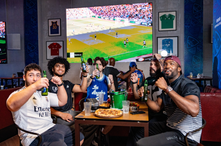 Satisfying matchday cravings inside the smart Topgolf Dubai fan zone.